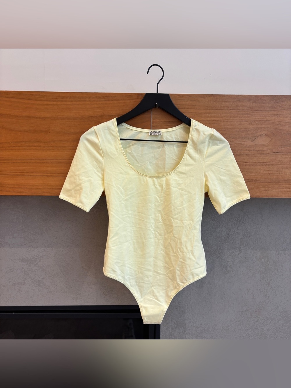 NWOT Intimately by Free People Butter Yellow bodysuit, Size XS